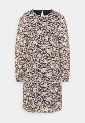 Robe fleurie avec un fond noir et des fleurs blanches, violettes et jaunes. Manches longues, col rond et détail de dos en trou de serrure.