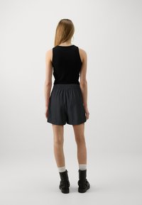 JDY SAY STRING NOOS - Träningsbyxor - black