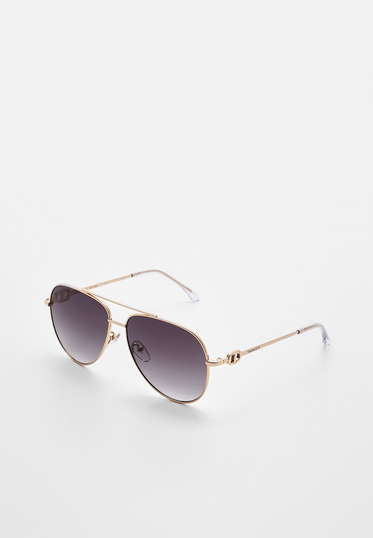 Aviator sunglasses with dark gradient lenses. Gold metal frame with adjustable nose pads and clear temple tips for comfort.