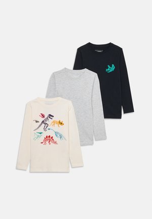 Drei langärmlige T-Shirts: cremefarben mit Dinosaurier-Drucken, hellgrau und marineblau mit einer Dinosaurier-Grafik, aus Baumwolle.
