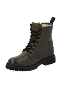 Mörkgrön läderboots med snörning och svarta snören, rund tå, gummisula och mjuk foder upptill. Har en dragflik.