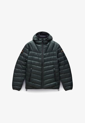 Padded hooded jacket in dark green. Features chevron quilted design, two front zip pockets, and elastic drawcord at the hem and hood.