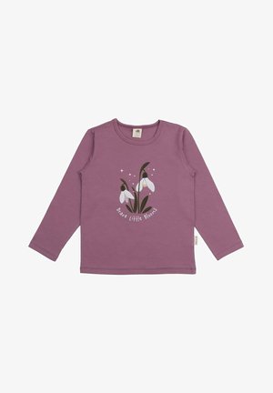 Lila langärmliges Baumwoll-T-Shirt mit einer Grafik von Schneeglöckchen und dem Text "Mutige kleine Blüten" unter dem Design.