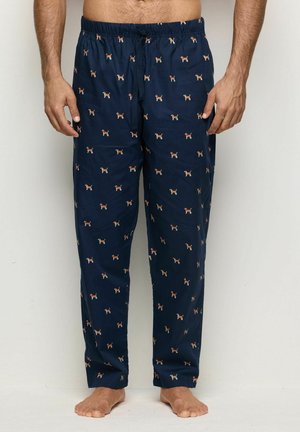 Pantalons de pyjama navy en tissu doux avec une taille à cordon, ornés d'un motif répété de petits chiens en orange et blanc.
