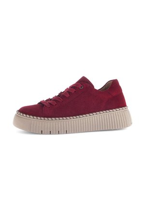 Low platform sneaker in dark red suede with matching laces and thick beige ribbed sole, side view on white background.