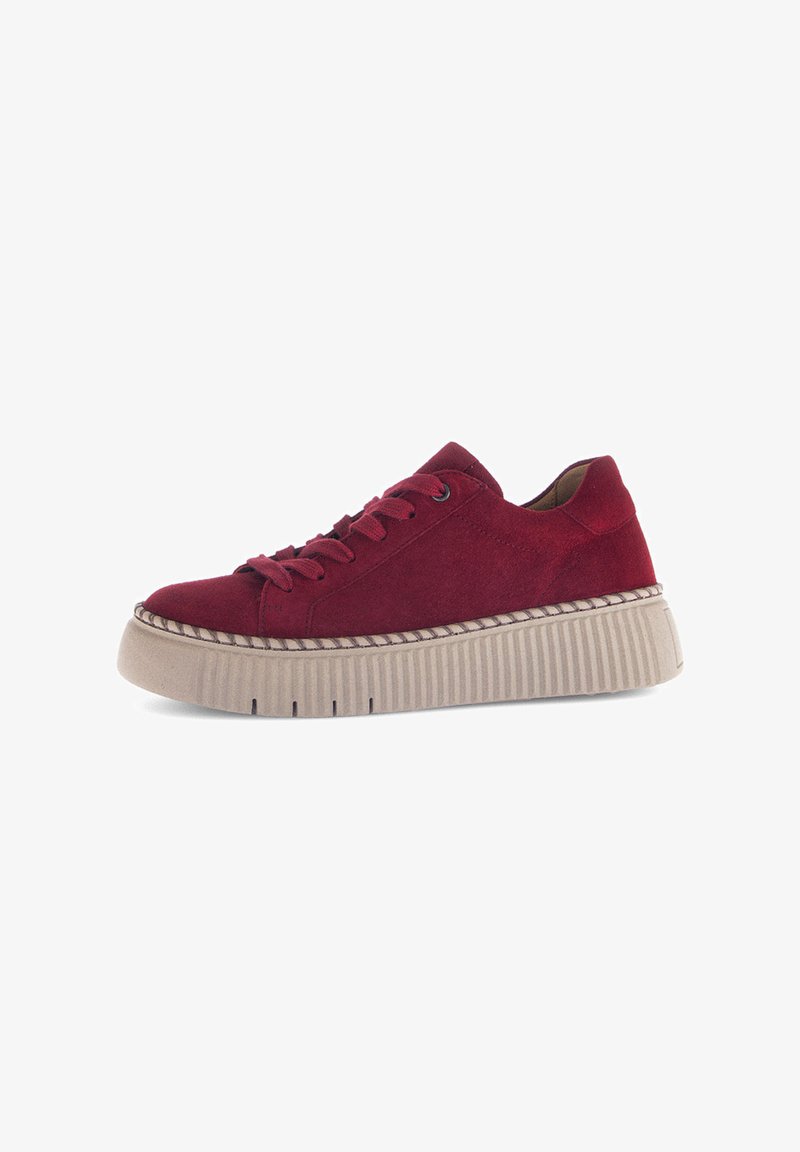 Low platform sneaker in dark red suede with matching laces and thick beige ribbed sole, side view on white background.