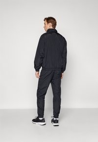 Sergio Tacchini NAYLA - Tréningruha alsók - black/gardenia
