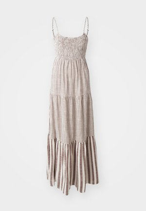 Vestido maxi con tirantes finos, corsé fruncido y un dobladillo en capas. Presenta rayas verticales alternando entre marrón y crema en toda su extensión.