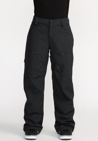 Pantalons cargo noirs avec une coupe ample, plusieurs poches, fermeture à bouton et zones de genoux renforcées, fabriqués à partir d'un tissu durable.