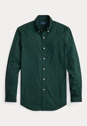 Camisa de botão quadriculada em verde e azul marinho com colarinho espalhado, mangas longas e botões brancos. Apresenta um pequeno logotipo bordado no peito.