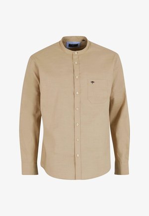 Heled kreemikas pikkade varrukatega särk bändikaelusega, ees oleva taskuga ja nööbiga kinnitusega, millel on tasku pehme logo detail.