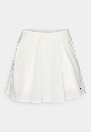 White athletic skirt with a smooth texture, pleated design, elastic waistband, and a small black logo on the lower right side.