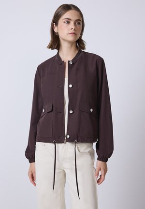 Dark brown bomber jacket with side pockets, button closure, and adjustable drawstring hem; made of smooth fabric with a fitted design.