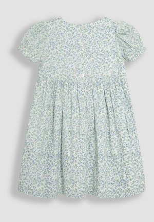 Virágmintás pamut ruha rövid puffos ujjakkal, világoszöld háttérrel és kék virágmintával. Hátul gombos záródás jellemzi.