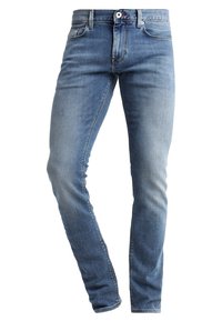 Vaaleansiniset farkut kapealla istuvuudella, viiden taskun mallilla, haalistuneella pinnalla, vyölenkeillä ja vetoketjusuljennalla.