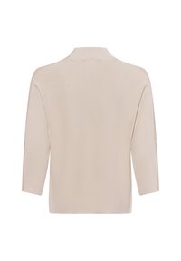 Cardigan color crema con una vestibilità comoda, texture a coste e maniche a tre quarti. Presenta un colletto morbido e nessun tipo di chiusura visibile.