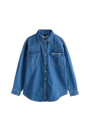 Cămașă din denim de culoare albastru deschis, cu nasturi pe față, două buzunare pe piept și textul "The Rolling Stones" brodat în alb.