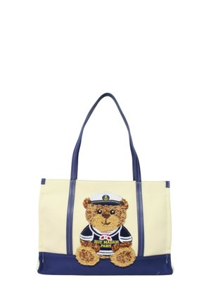 Borsa a tracolla beige e blu navy con manici blu, raffigurante un orsetto con indosso un cappello da marinaio e una maglietta ricamata con la scritta "Rue Madam Paris".