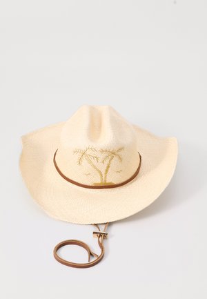 Chapeau de paille à large bord, couleur crème, avec une broderie de palmier à l'avant. Bandoulière en cuir marron avec une sangle ajustable.