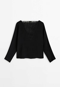 Blouse noire à manches longues avec un décolleté en V profond présentant un panneau en dentelle à l'avant.