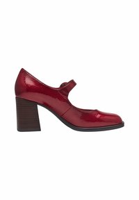 Chaussure Mary Jane en cuir verni rouge avec talon bloc et bride unique, vue de côté sur fond blanc.