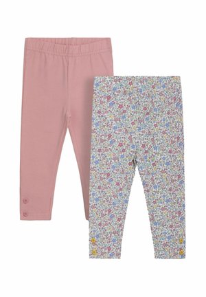 Kaksi leggings-paria: toinen yksivärinen vaaleanpunainen, jossa on joustava vyötärö ja nappikoristeet, ja toinen kuvioitu värikkäillä kukkakuosisilla valkoisella taustalla.