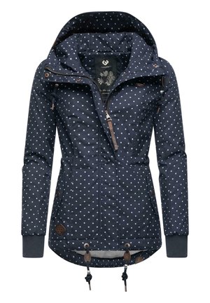 Navy blue jacket with white polka dots, adjustable hood, front zipper, side pockets, and toggle adjustable hem. Features leather accents.