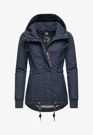 Navy blue jacket with white polka dots, adjustable hood, front zipper, side pockets, and toggle adjustable hem. Features leather accents.