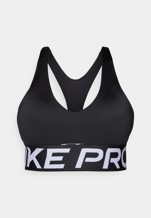 Reggiseno sportivo nero con scollo a V, spalline rastremate a forma di X e una fascia bianca spessa con la scritta "Pro" in basso. Tessuto liscio ed elastico.