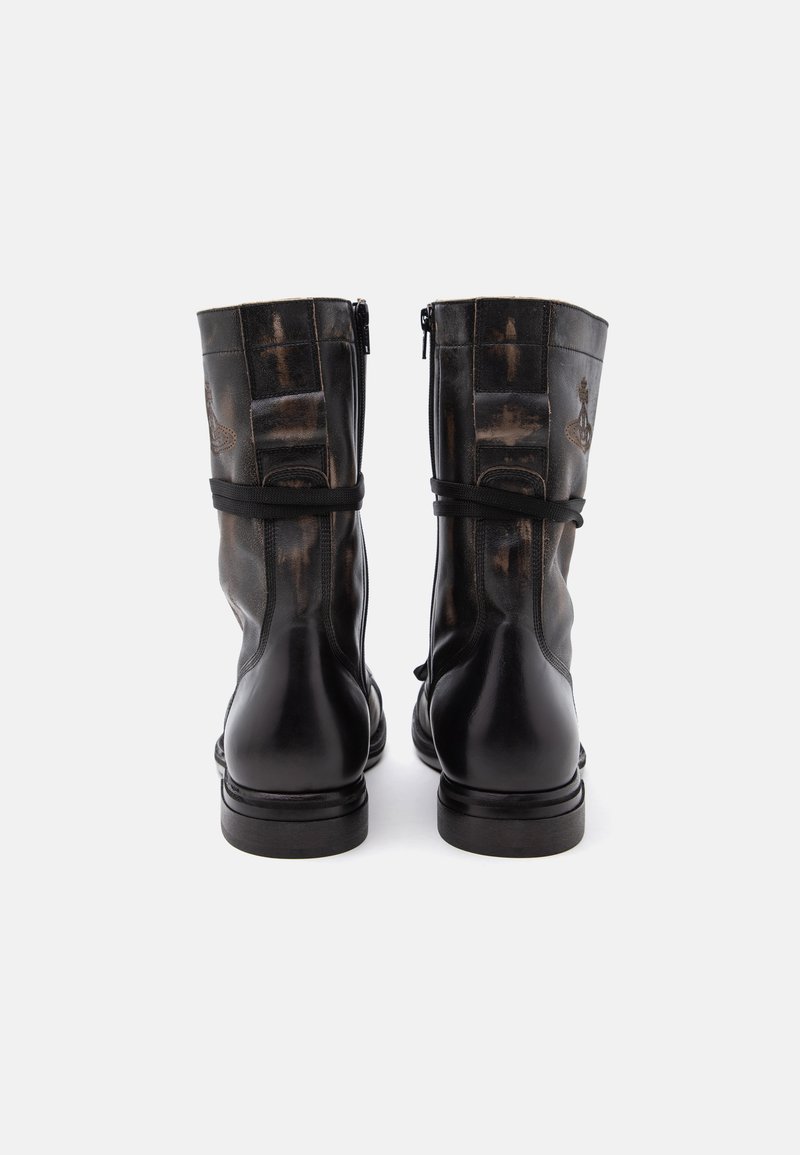 Pair of black leather mid-calf boots with side zippers and decorative stitching, shown from the back on a white background.