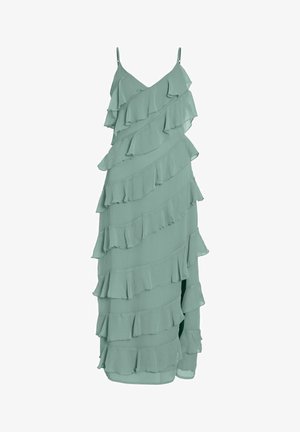 Jasnozielona maxi sukienka bez rękawów, z ukośnymi, warstwowymi falbanami i cienkimi, regulowanymi ramiączkami.