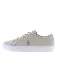 Light beige low-top canvas sneaker with white rubber sole, lace-up closure, and U.S. Polo Assn. logo on side and sole.