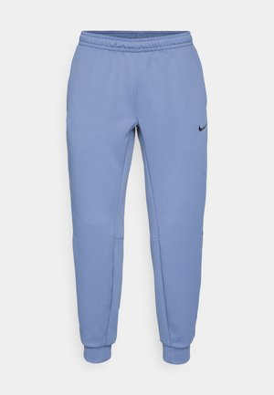 Nike byxor i ljusblått, tillverkade av mjukt material, har en tapered design, elastisk midja och en svart logotypfråga på vänster sida.