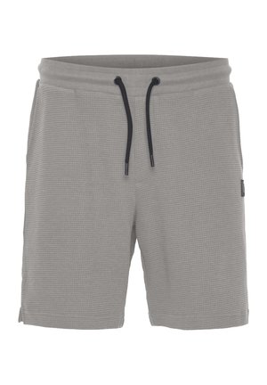 Gray waffle-textured shorts with a drawstring waist, side slits for ease of movement, and a small brand tag on the left side.