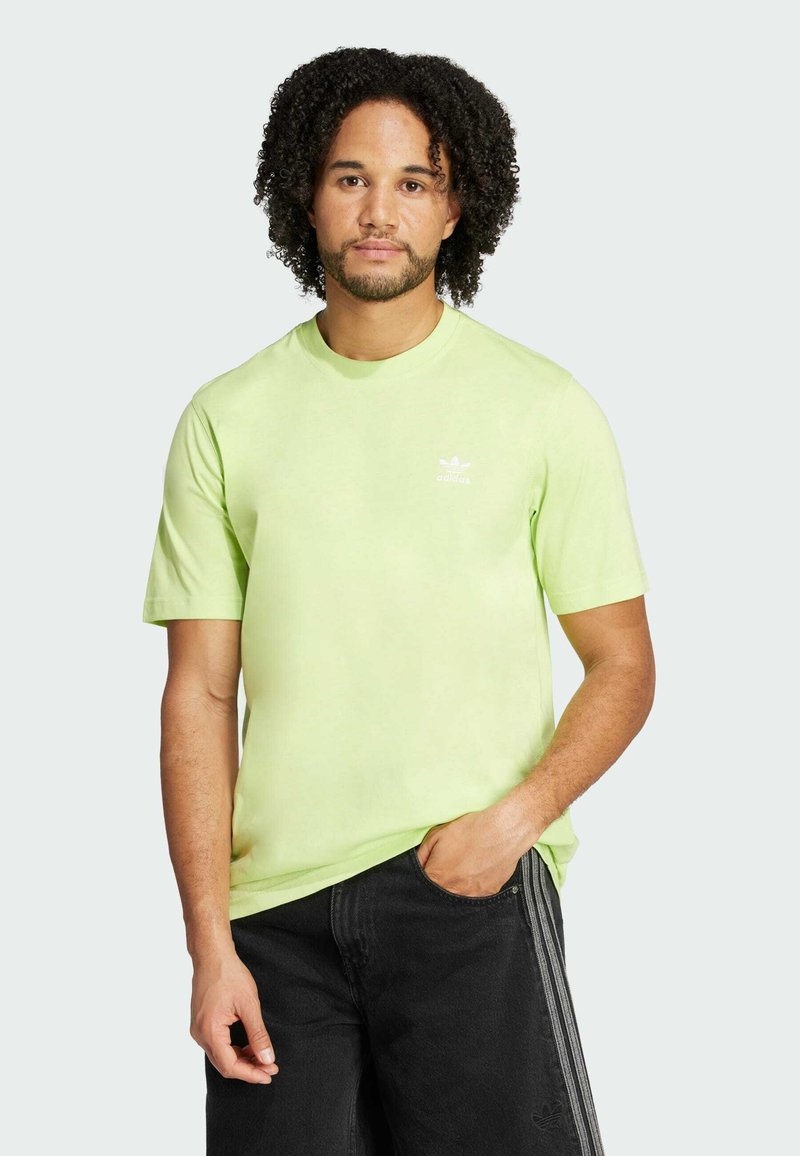 Light green cotton t-shirt with short sleeves and a crew neckline. Features a small white logo on the chest. Pairing with black shorts.