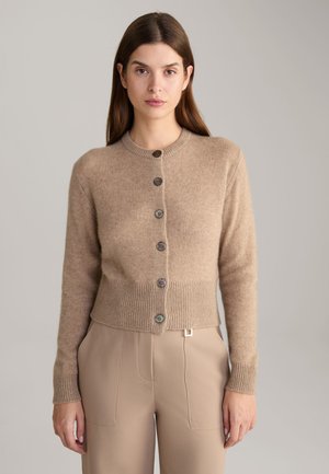 Beige cropped cardigan with a round neckline, ribbed cuffs, and six buttons in contrasting colors. Soft texture and simple design.