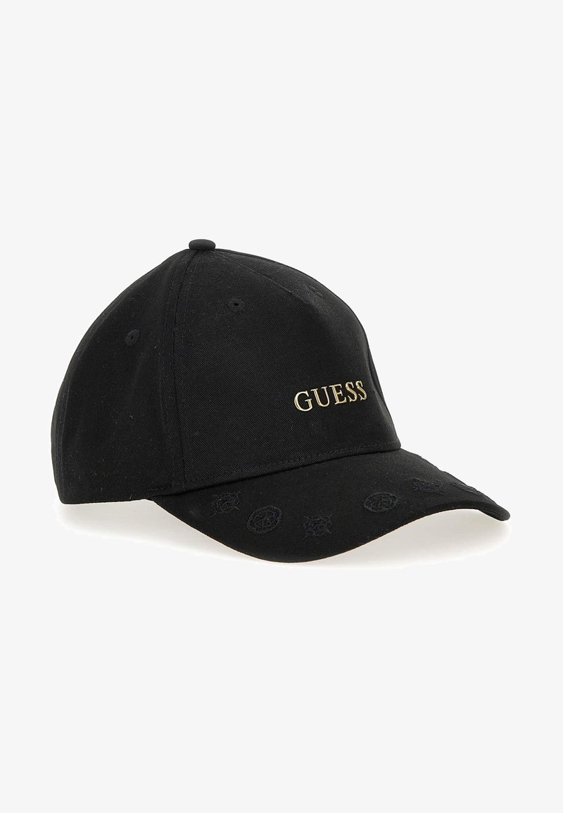 Black cotton baseball cap featuring raised gold "GUESS" logo, embroidered accents on the visor, and a structured crown.