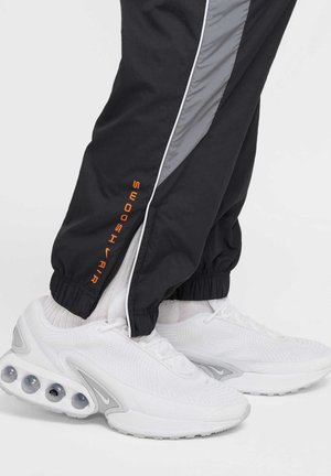 Nike Sportswear Pantalones deportivos - black fir white