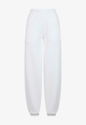 Witte trainingsbroek met een elastische tailleband, taps toelopende boorden en een gladde textuur. Eenvoudig ontwerp, geen zichtbare patronen of accenten.