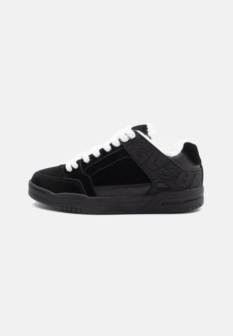 Black suede sneakers with white laces, textured black side panels, and embossed logo detail. Thick rubber sole with traction patterns.