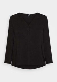 Maglietta nera a maniche lunghe con scollatura a V, morbido al tatto e vestibilità rilassata. Presenta una cucitura centrale e un orlo arrotondato sul retro.