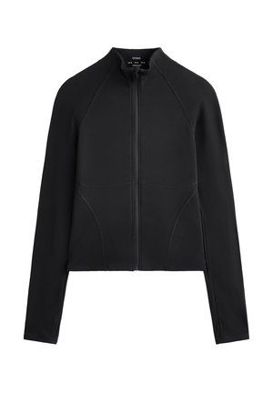 Veste noire zippée avec col haut, fabriquée en tissu extensible, mettant en avant des manches raglan et des coutures en panneaux pour un design ajusté.