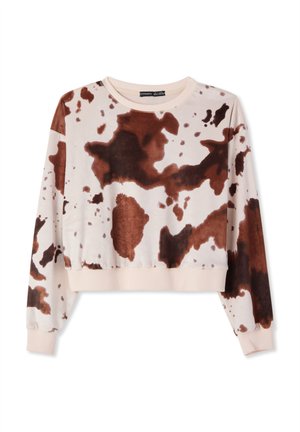 Felpa corta in tessuto morbido con base color crema e ampio motivo a macchie marroni. Presenta polsini e scollo a costine.