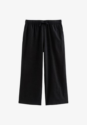 Zwarte wijde broek met elastische tailleband en verstelbare trekkoord, gemaakt van zachte stof met zijzakken.