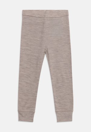 Beige ribstrikkede leggings med elastisk talje og tætsiddende ankelflip, lagt fladt på en hvid baggrund.