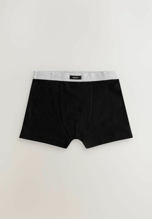 Svarta boxertrosor med ett grått elastiskt midjeband som har varumärket "NEXT". Slät tyg med en åtsittande design.