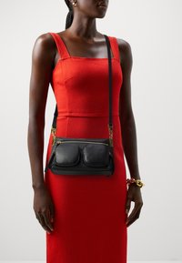 Coccinelle COCCINELLEHYLE - Handbag - noir