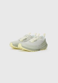 Pair of light grey and pale yellow athletic running shoes angled left on white background.