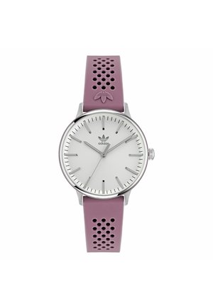 Montre ronde en argent avec un cadran blanc, des index horaires argentés et un bracelet en silicone perforé violet clair. Dotée du logo Adidas sur le cadran.