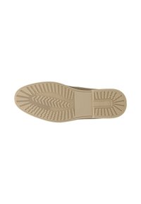 Semelle d’une chaussure beige avec un dessin de bande de roulement comportant des rainures diagonales et rectangulaires pour l’adhérence et une partie talon texturée.